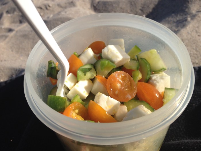 Tomato cucumber feta salad with homegrown mint and basil. Photo by Amy Sowder.